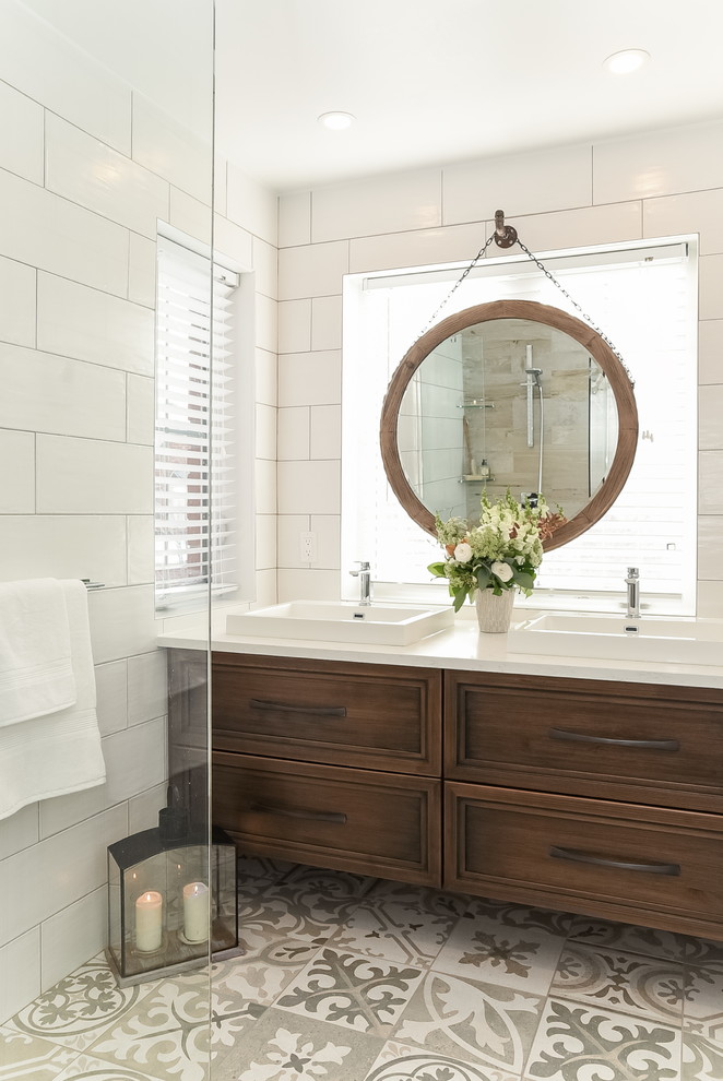 This is an example of a beach style master bathroom in Ottawa with furniture-like cabinets, a curbless shower, a two-piece toilet, beige tile, subway tile, white walls, mosaic tile floors, a vessel sink, engineered quartz benchtops, beige floor and an open shower.