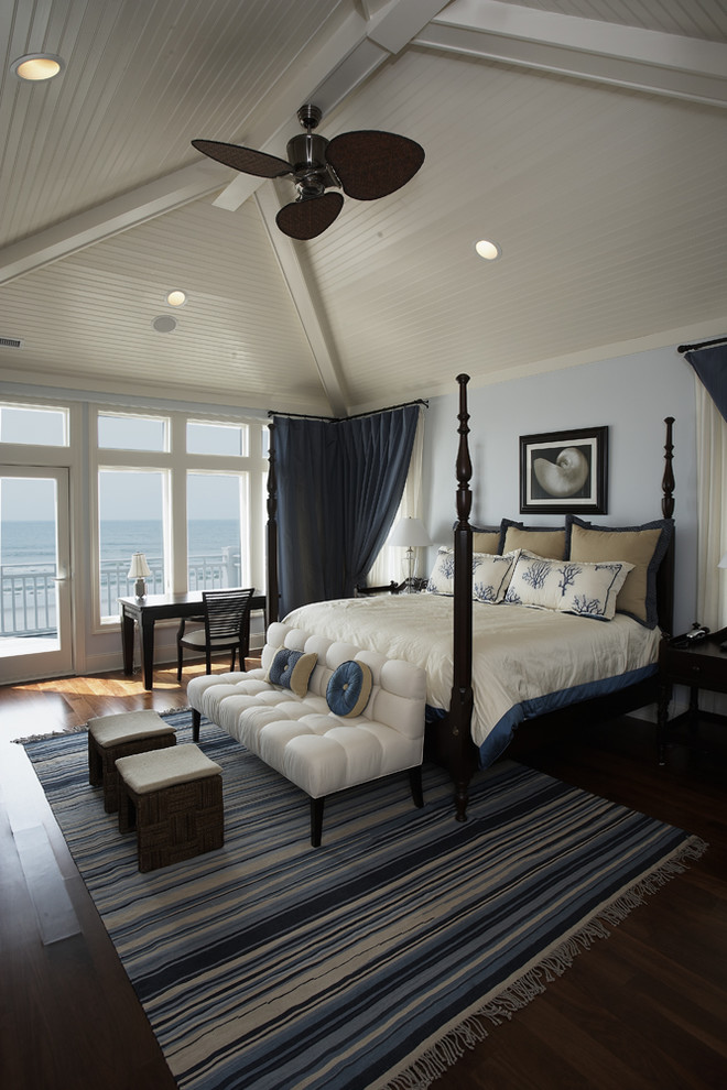 Design ideas for a mid-sized beach style master bedroom in Miami with blue walls, dark hardwood floors and no fireplace.