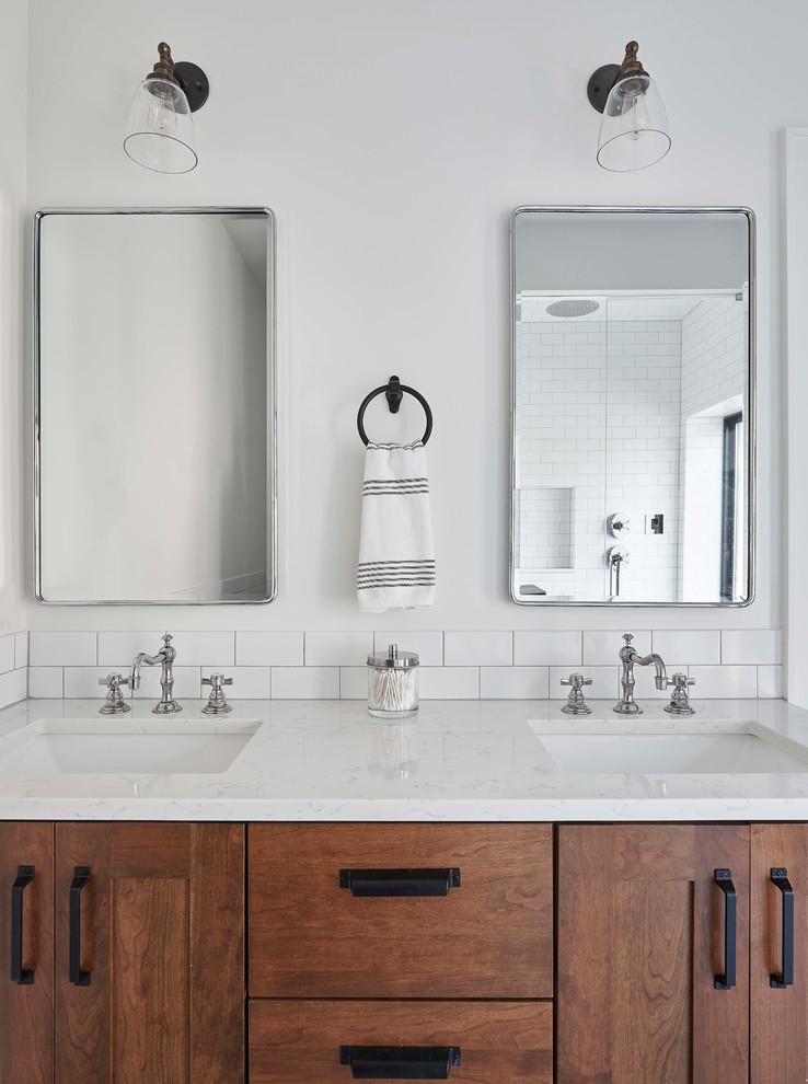Example of a mid-sized transitional master white tile and ceramic tile bathroom design in Chicago with medium tone wood cabinets, white walls, an undermount sink, shaker cabinets and white countertops