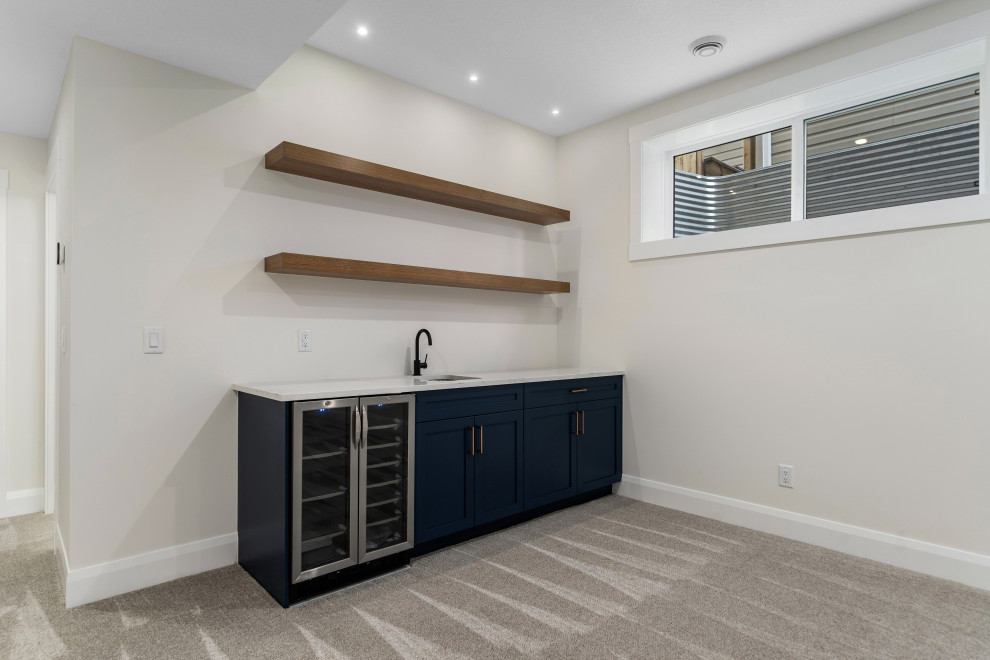 Example of a transitional home bar design in Calgary