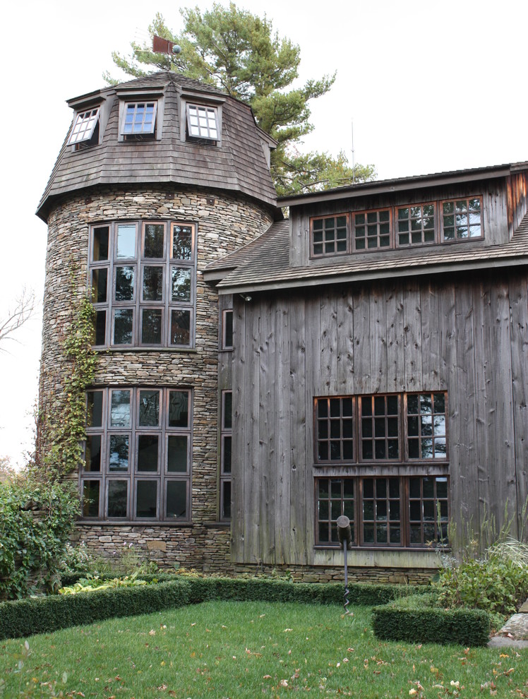 Inspiration for a country exterior in New York with wood siding.
