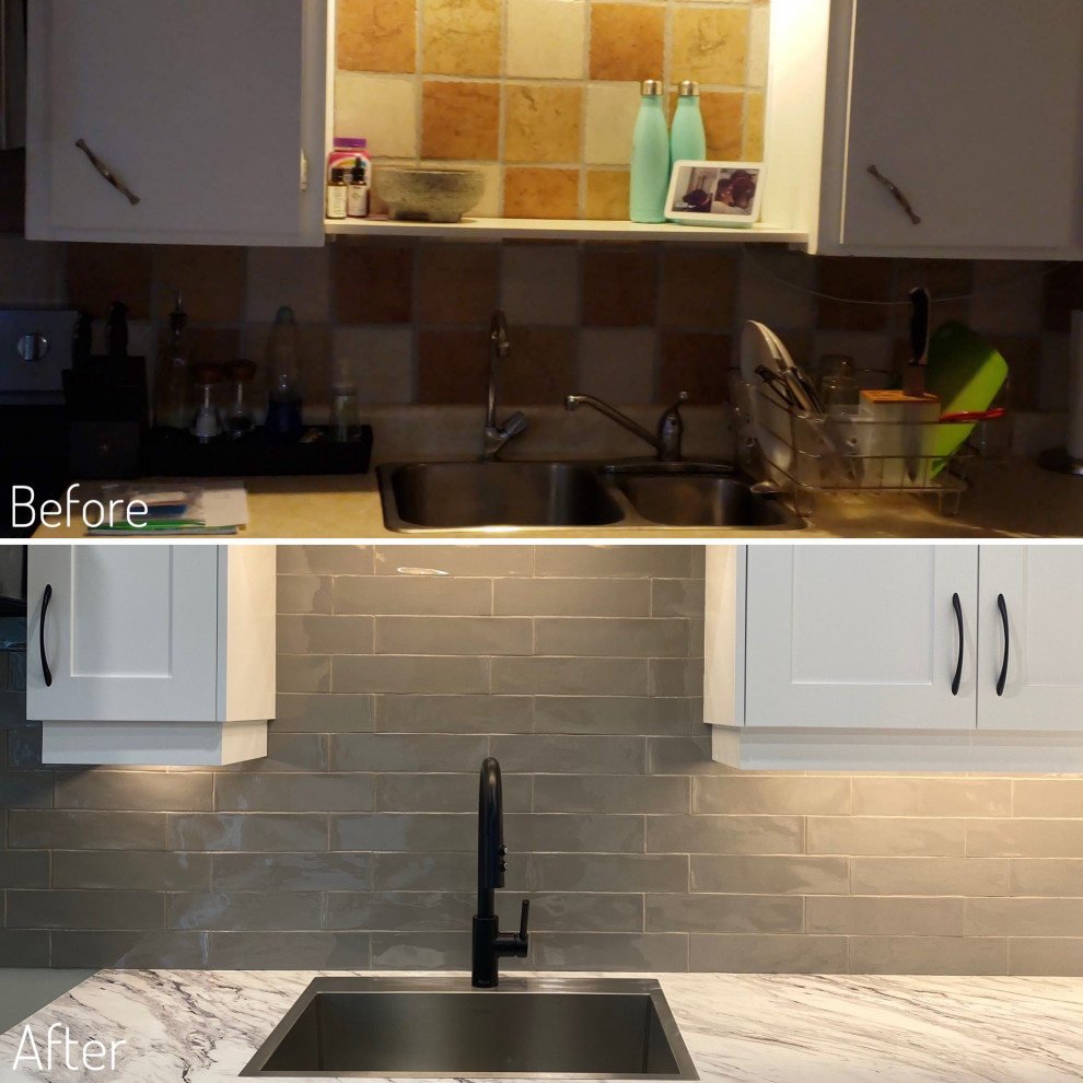 Mid-sized transitional galley vinyl floor eat-in kitchen photo in Toronto with a drop-in sink, shaker cabinets, white cabinets, laminate countertops, gray backsplash and stainless steel appliances