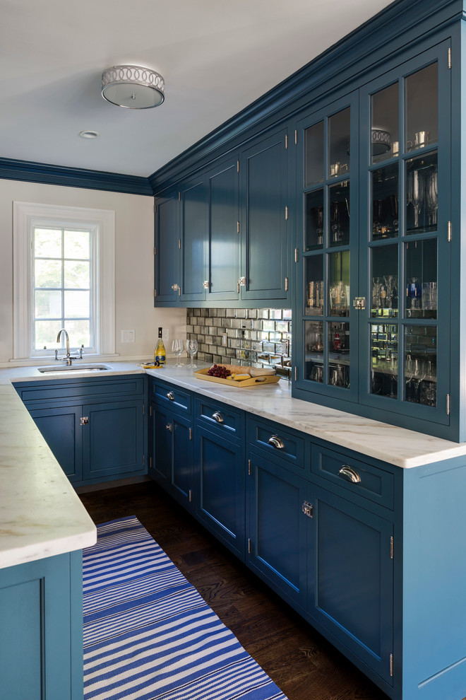 Design ideas for a transitional u-shaped home bar in Other with an undermount sink, shaker cabinets, blue cabinets, mirror splashback and dark hardwood floors.