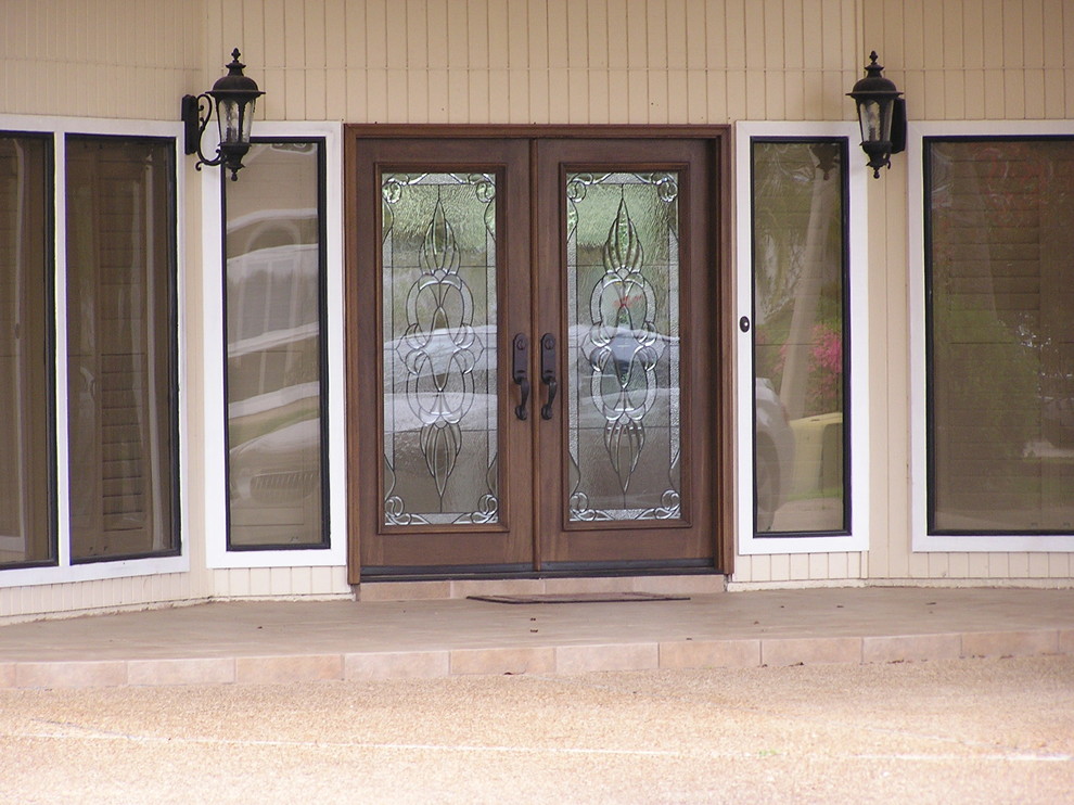 Front door - large rustic front door idea in Miami with beige walls and a dark wood front door