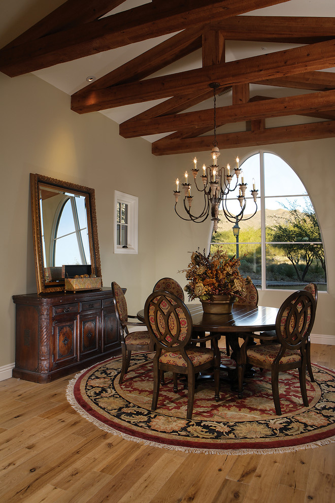 This is an example of a large mediterranean dining room in Phoenix.