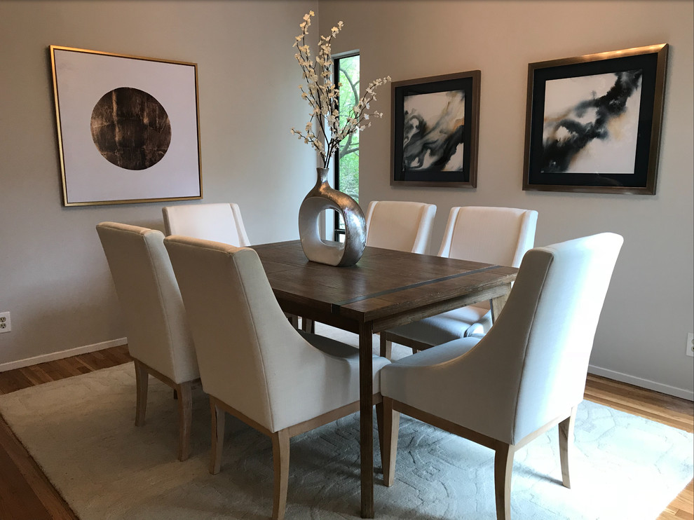 Design ideas for a small contemporary separate dining room in Portland with grey walls, medium hardwood floors, no fireplace and brown floor.