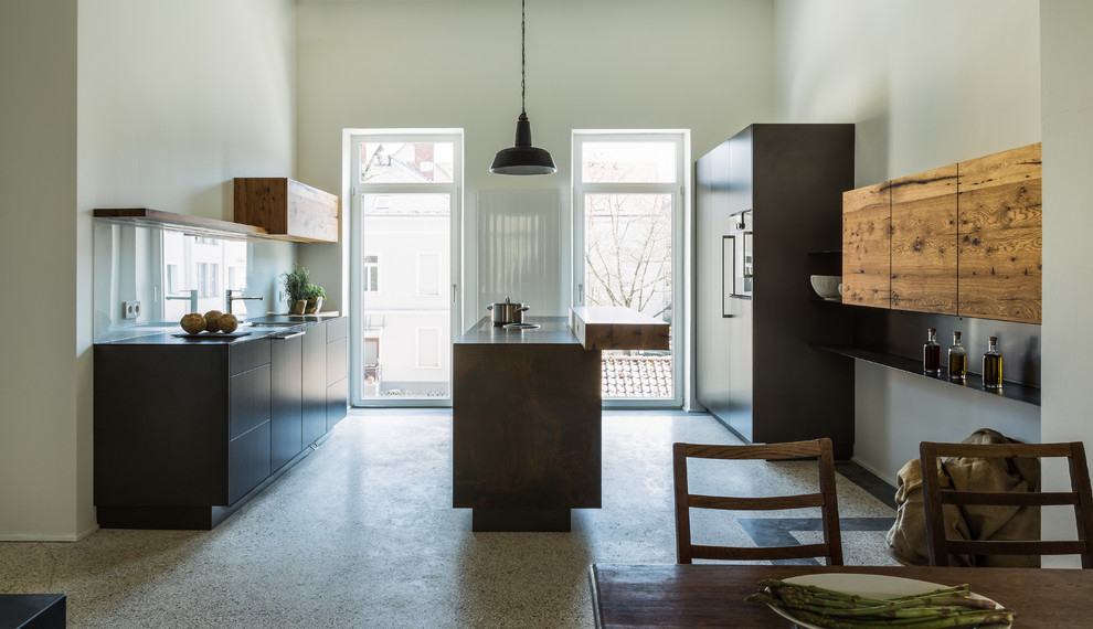 Inspiration for a mid-sized contemporary galley eat-in kitchen in Stuttgart with flat-panel cabinets, glass sheet splashback, terrazzo floors, with island and multi-coloured floor.