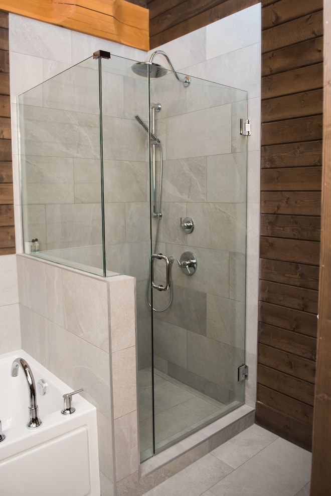 Photo of a large country master bathroom in Vancouver with shaker cabinets, dark wood cabinets, an alcove tub, an alcove shower, a two-piece toilet, gray tile, ceramic tile, brown walls, laminate floors, an undermount sink, granite benchtops, brown floor, a hinged shower door and grey benchtops.