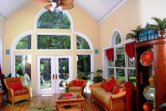 Photo of a large traditional sunroom in Orange County with light hardwood floors, no fireplace and a standard ceiling.