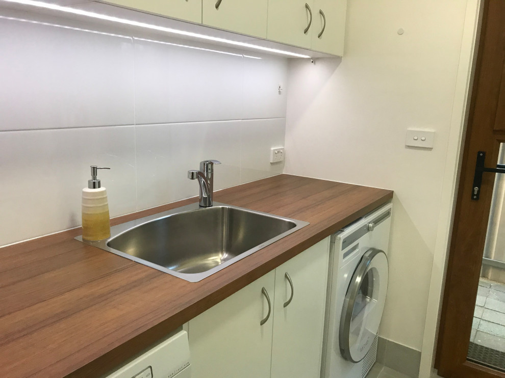 Inspiration for a contemporary laundry room in Other.