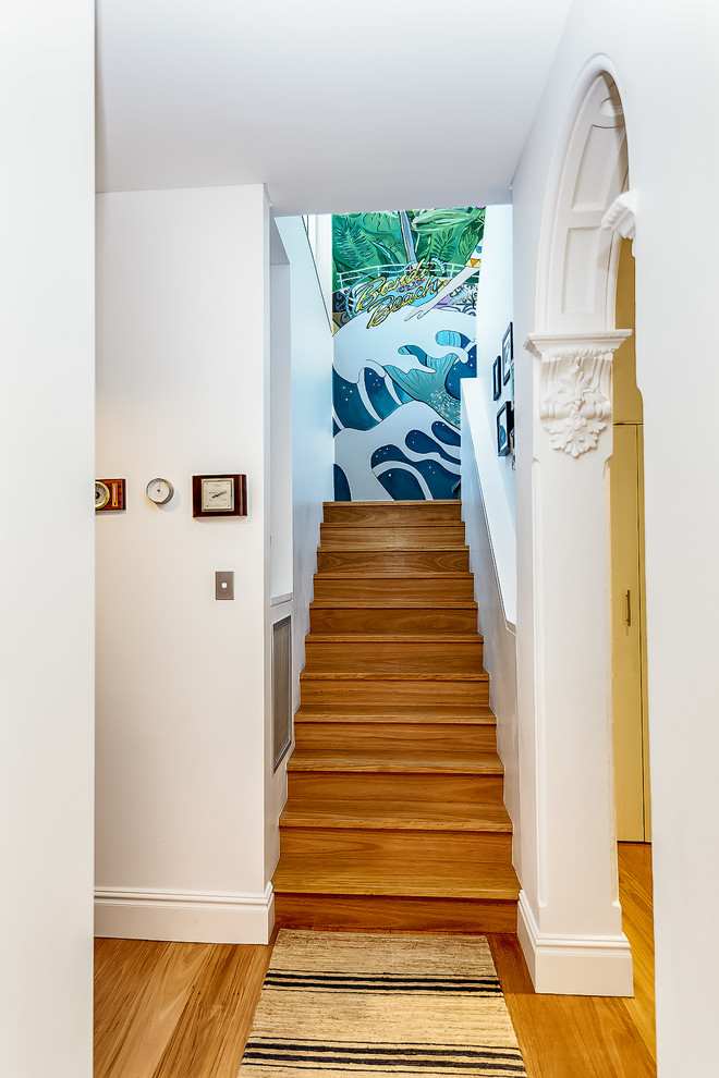 This is an example of a large contemporary wood u-shaped staircase in Wollongong.