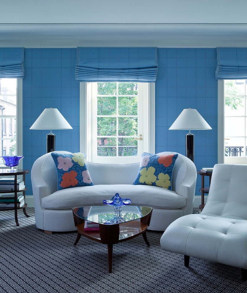 Photo of a transitional master bedroom in New York with blue walls and carpet.