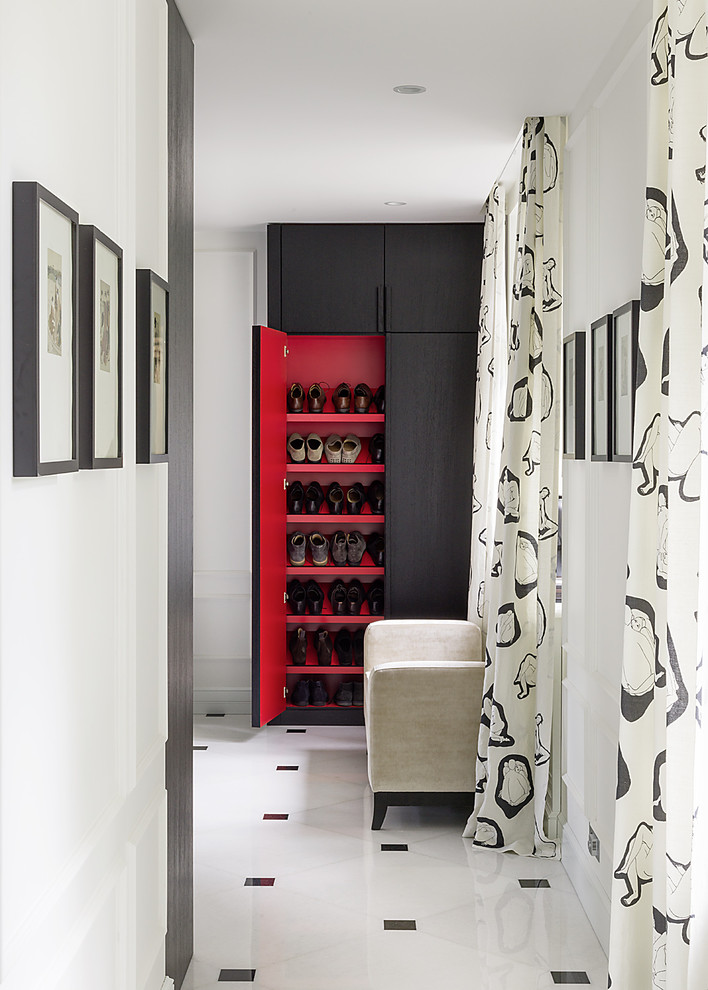 Inspiration for a contemporary gender-neutral storage and wardrobe in Moscow with flat-panel cabinets, dark wood cabinets and multi-coloured floor.