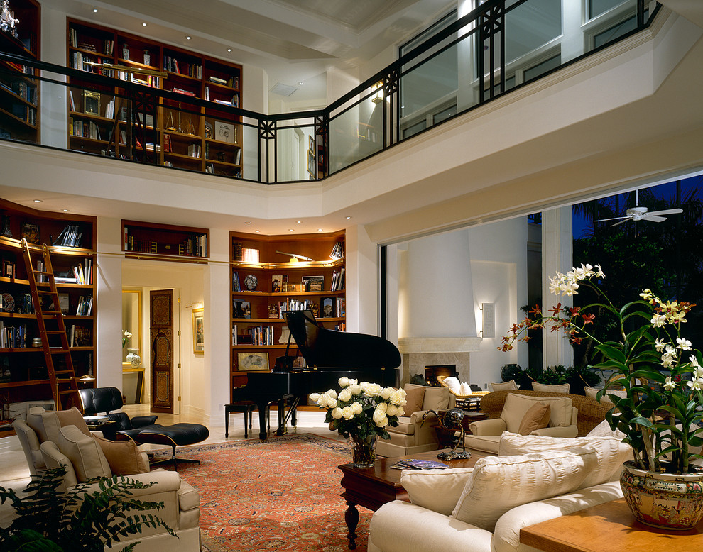 Photo of a traditional living room in Miami with a library.