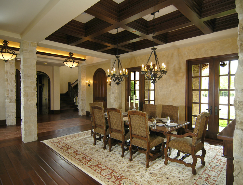 Design ideas for an expansive mediterranean dining room in Grand Rapids with beige walls and dark hardwood floors.