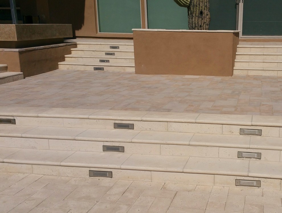 Photo of a contemporary backyard patio in Phoenix with concrete pavers and no cover.