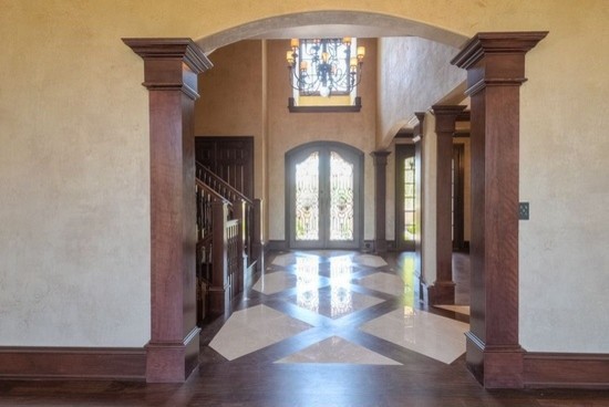 Front door - huge transitional concrete floor front door idea in Phoenix with beige walls and a glass front door