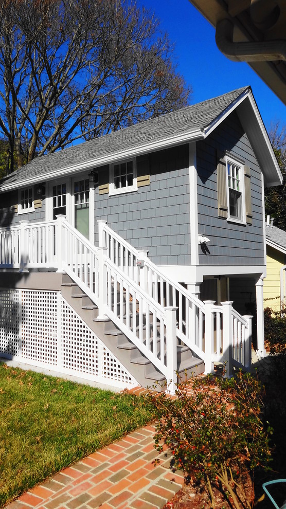 This is an example of a small beach style two-storey grey exterior in Other with concrete fiberboard siding.