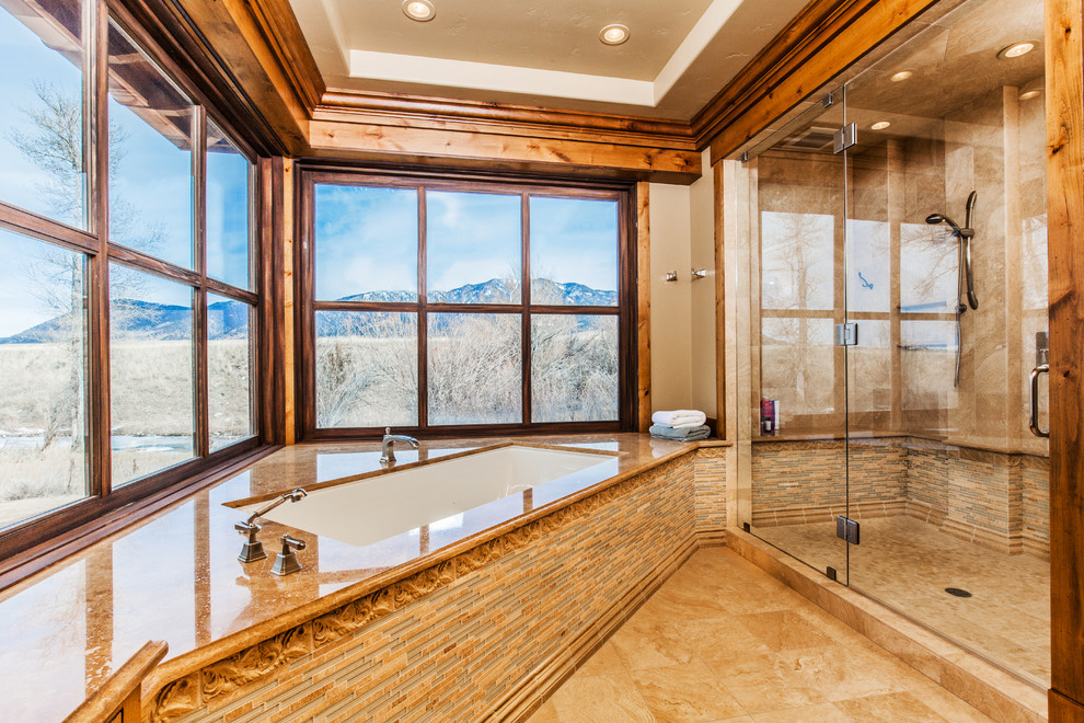Large mountain style master beige tile and ceramic tile ceramic tile double shower photo with beaded inset cabinets, medium tone wood cabinets, an undermount tub, beige walls, an undermount sink and granite countertops