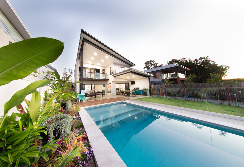 Inspiration for a beach style two-storey white house exterior.