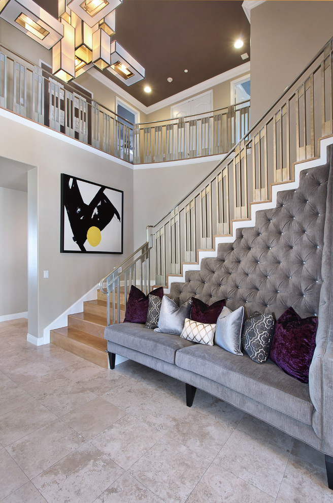 Inspiration for a large contemporary wood l-shaped staircase in Orange County with wood risers and metal railing.