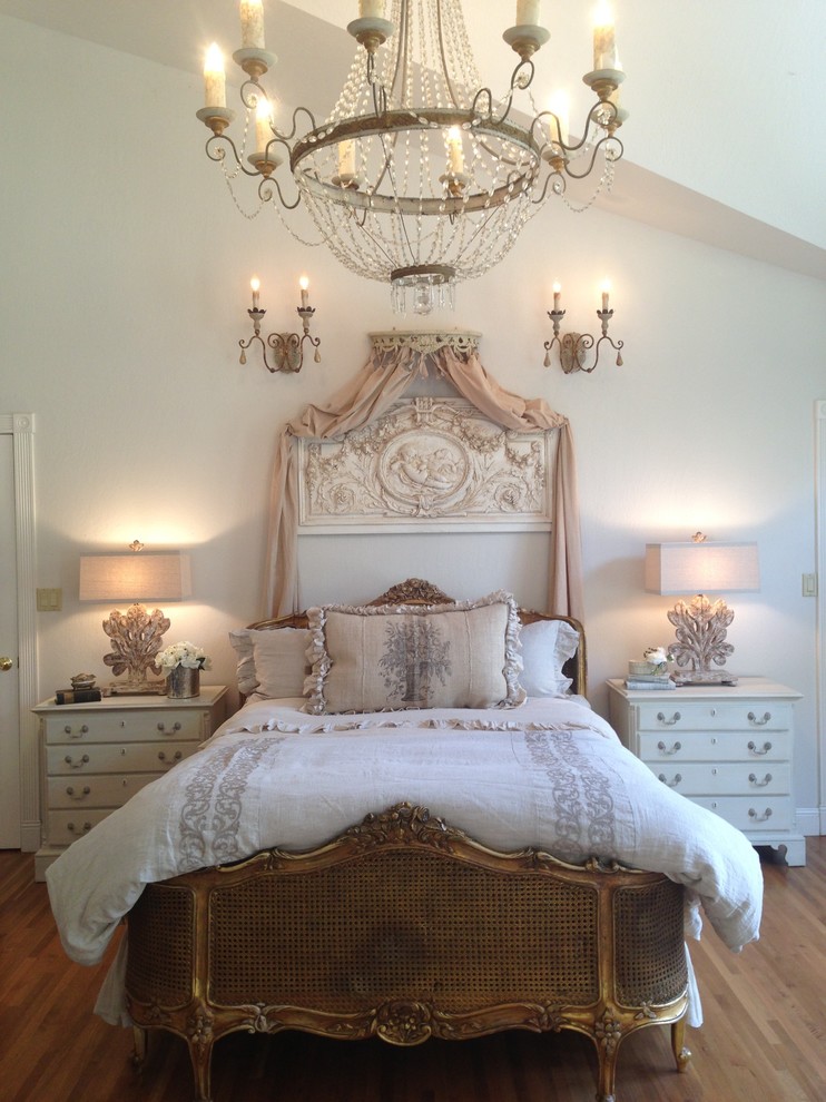 Large traditional master bedroom in San Francisco with grey walls, light hardwood floors and no fireplace.