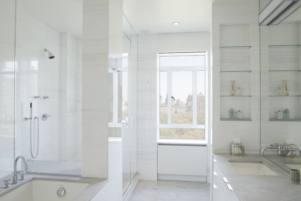 Design ideas for a contemporary bathroom in New York with white tile and stone slab.
