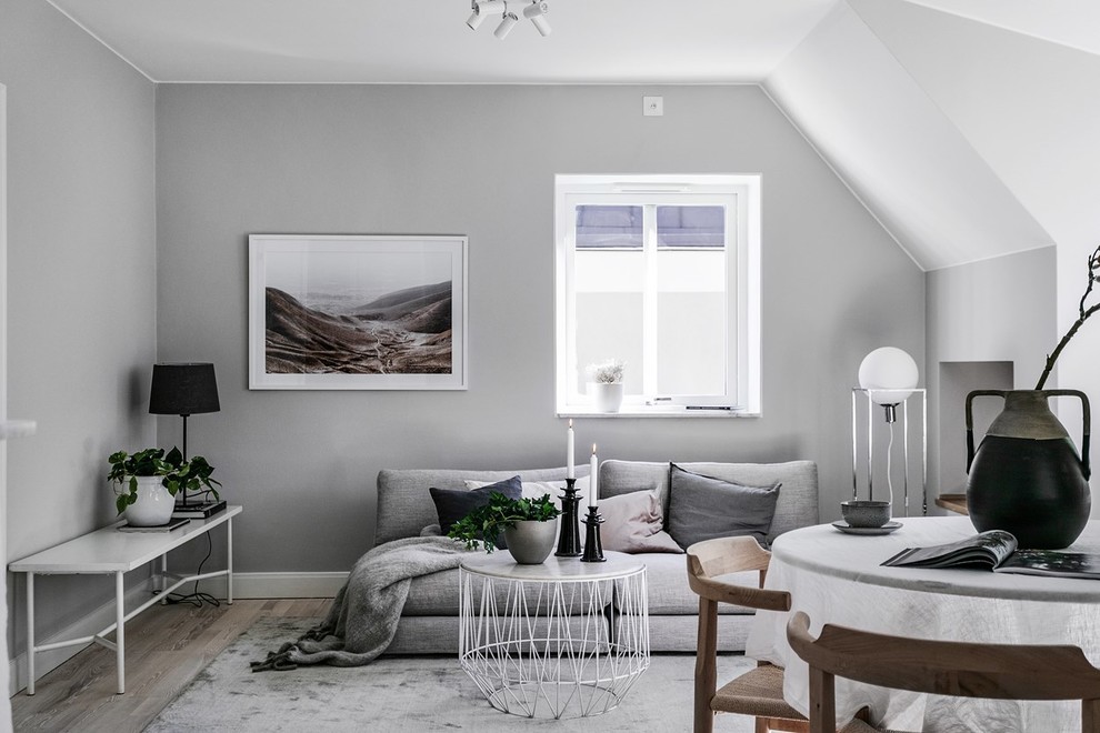 Design ideas for a scandinavian living room in Stockholm with grey walls.