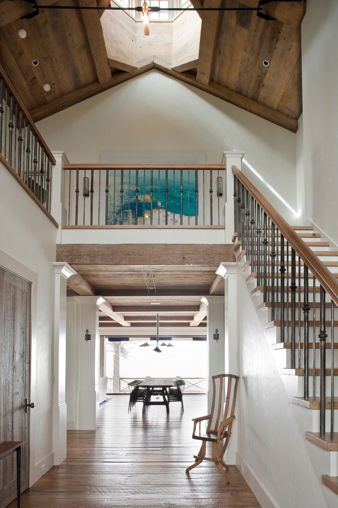 Inspiration for a beach style wood straight staircase in New York.