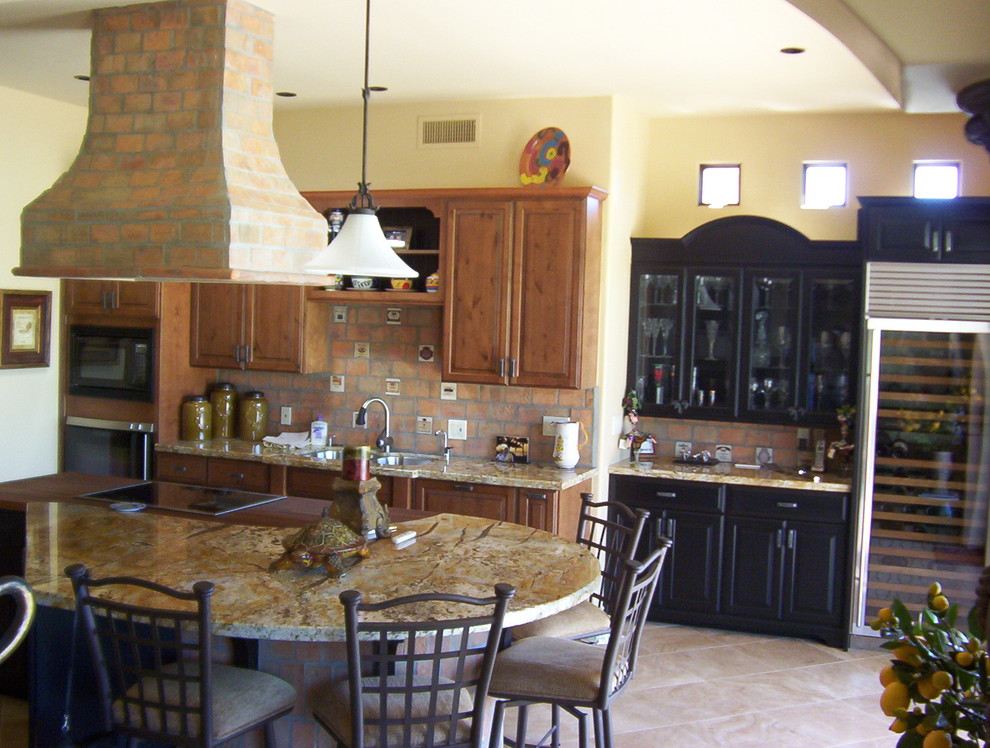 Inspiration for a kitchen remodel in Phoenix with gray cabinets, laminate countertops and two islands