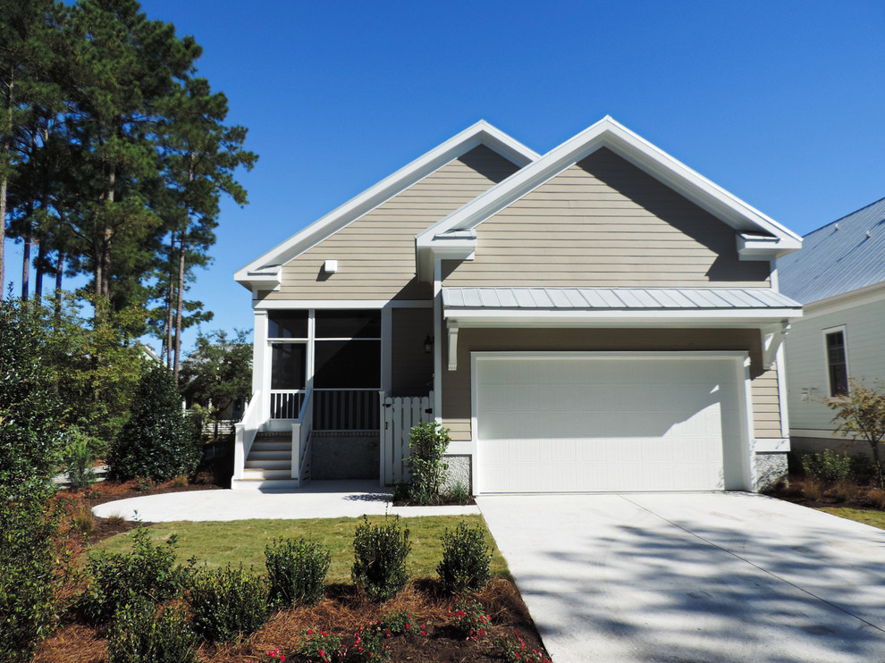 Photo of a beach style two-storey exterior in Other with concrete fiberboard siding.