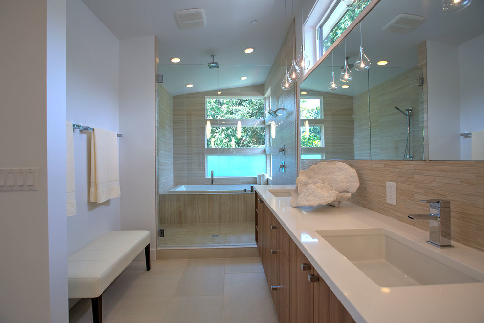 Inspiration for a large modern master bathroom in Seattle with flat-panel cabinets, medium wood cabinets, a drop-in tub, a double shower, brown tile, porcelain tile, grey walls, ceramic floors, an undermount sink, engineered quartz benchtops, beige floor, a hinged shower door and white benchtops.