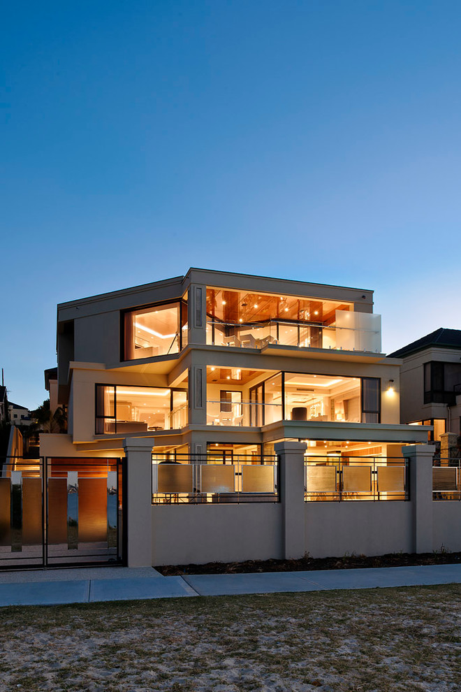 Design ideas for a contemporary three-storey beige exterior in Perth.