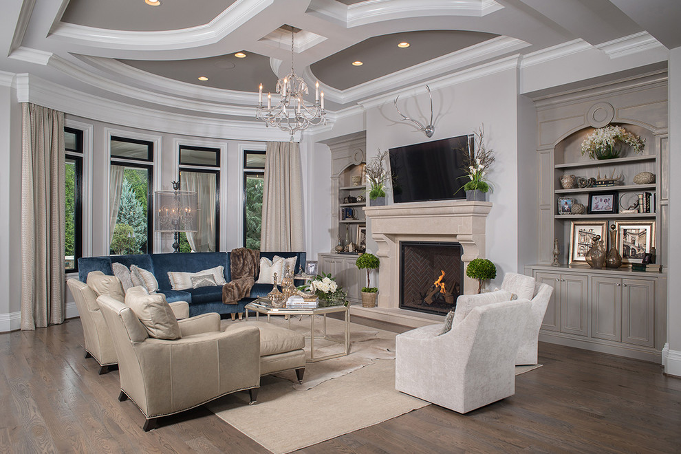 This is an example of a traditional living room in Other with beige walls, medium hardwood floors and a standard fireplace.