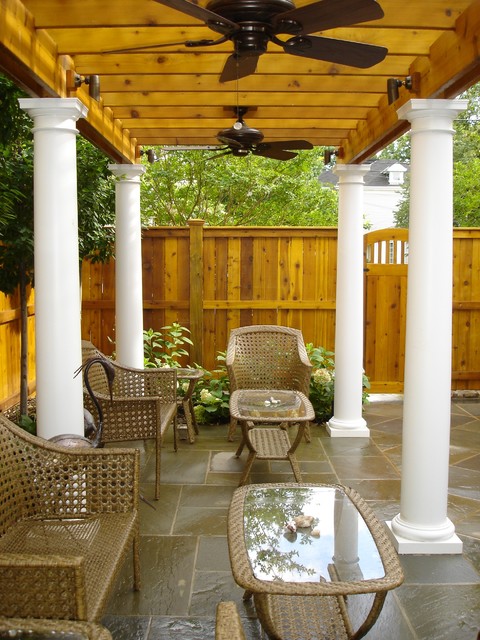 Wood Pergola With White Columns Ceiling Fans And Flagstone