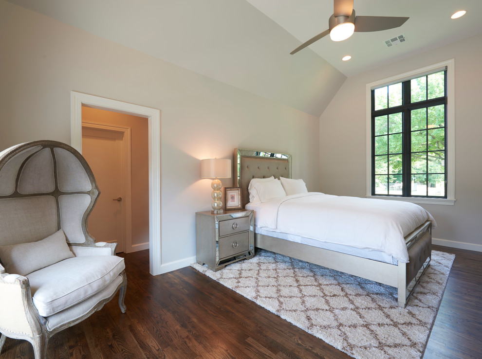 Bedroom - mid-sized transitional guest medium tone wood floor bedroom idea with beige walls and no fireplace