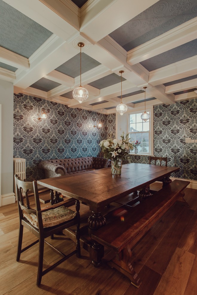 Mid-sized traditional dining room in Other with medium hardwood floors and multi-coloured walls.