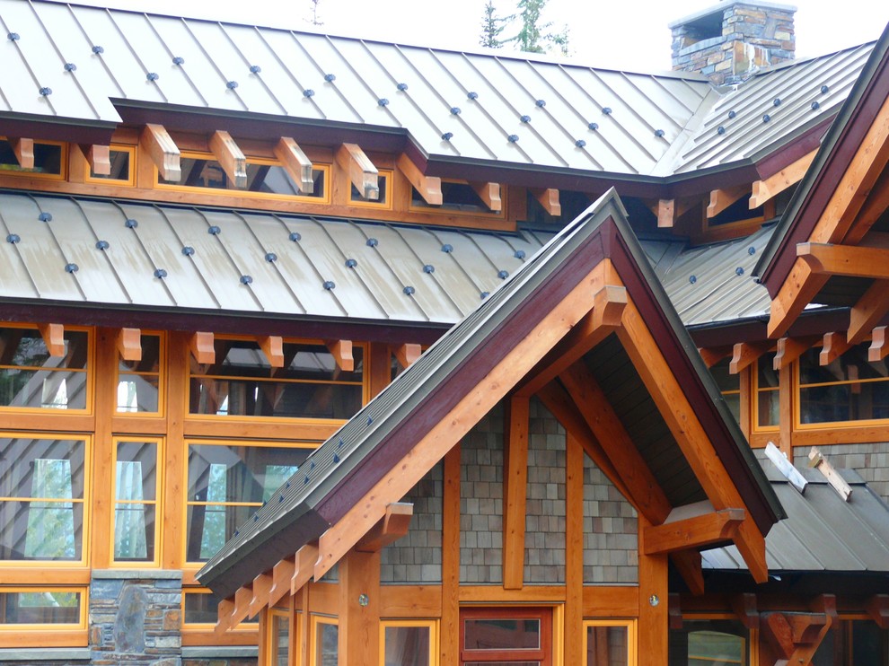 Example of a mountain style brown two-story mixed siding exterior home design in Other