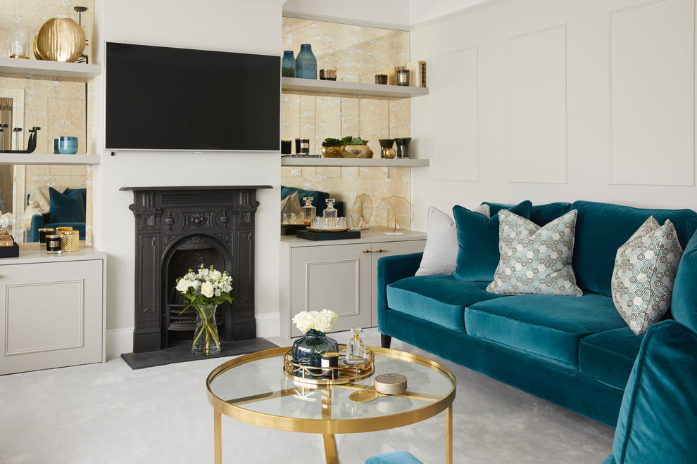 This is an example of a mid-sized transitional enclosed living room in Hertfordshire with grey walls, carpet, a wall-mounted tv, grey floor, a wood stove and a metal fireplace surround.
