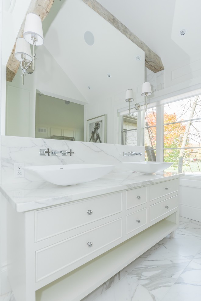 Photo of an expansive traditional master bathroom in Toronto with a vessel sink, white cabinets, marble benchtops, an open shower, white tile, porcelain tile, white walls and porcelain floors.