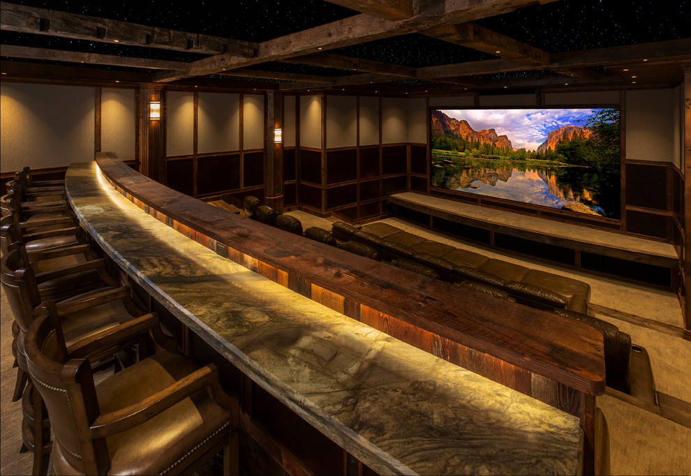 Design ideas for an expansive traditional enclosed home theatre in Denver with beige walls, carpet and a projector screen.