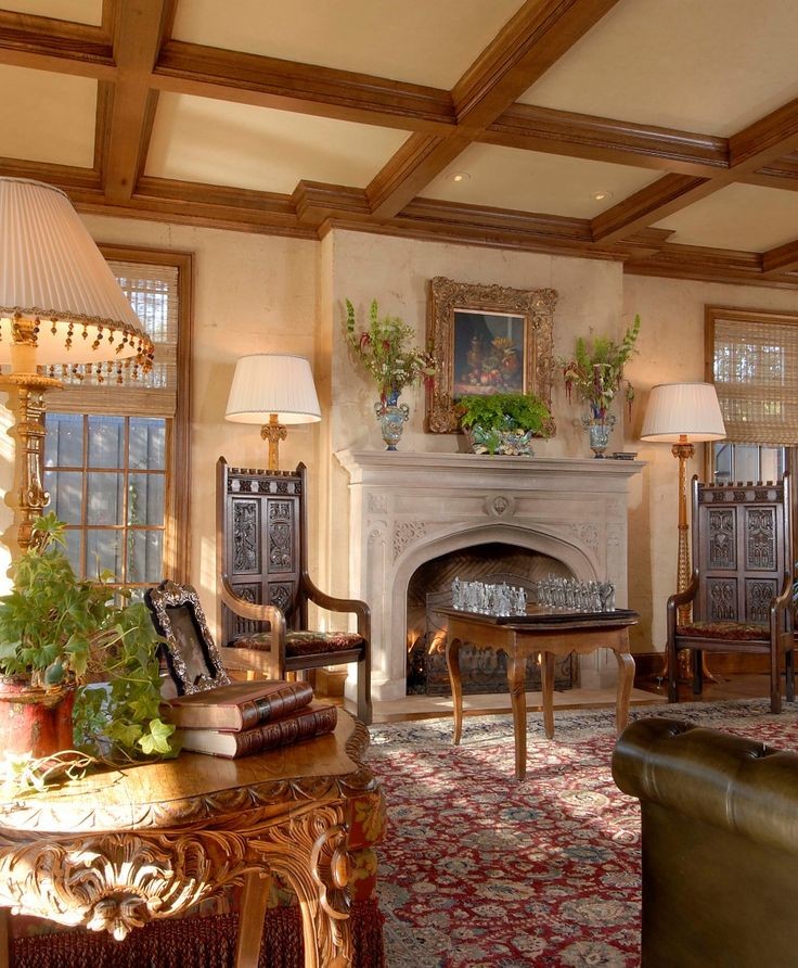 Design ideas for a mid-sized traditional formal enclosed living room in Dallas with beige walls, medium hardwood floors, a standard fireplace, a stone fireplace surround and no tv.