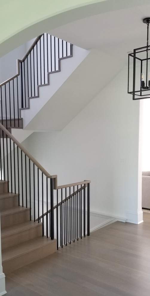 Transitional wooden mixed material railing staircase photo in Chicago with wooden risers