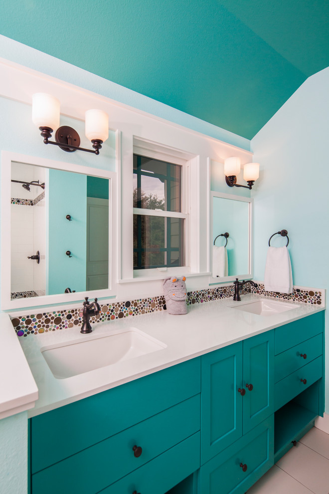 Inspiration for a small transitional kids bathroom in Austin with an undermount sink, blue cabinets, engineered quartz benchtops, blue walls, multi-coloured tile, mosaic tile and shaker cabinets.