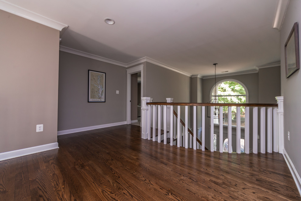 Large arts and crafts hallway in Baltimore with grey walls, dark hardwood floors and blue floor.