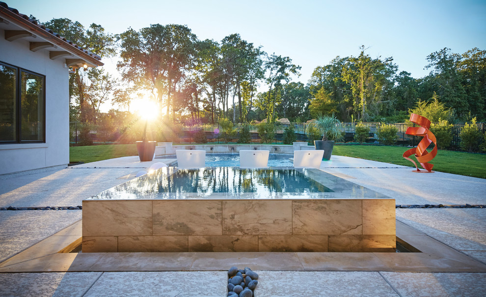 Design ideas for a large contemporary backyard custom-shaped pool in Dallas with a hot tub and stamped concrete.