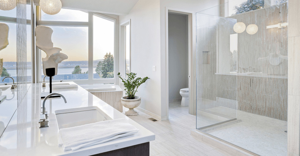 Photo of a mid-sized contemporary master bathroom in San Francisco with black cabinets, a one-piece toilet, white tile, grey walls, tile benchtops, a drop-in tub, ceramic floors, an undermount sink, grey floor, an open shower, a curbless shower, flat-panel cabinets and ceramic tile.