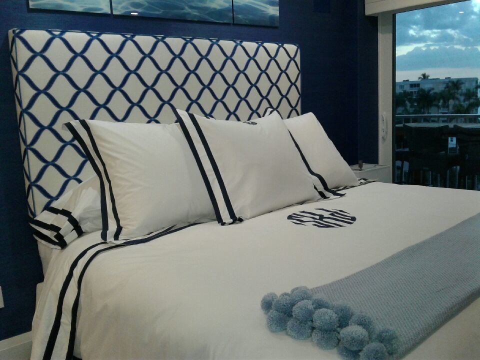 Example of a mid-sized transitional master bedroom design with blue walls and no fireplace