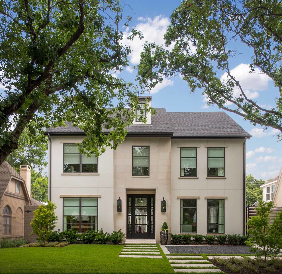 This is an example of a transitional three-storey stucco grey exterior in Dallas.