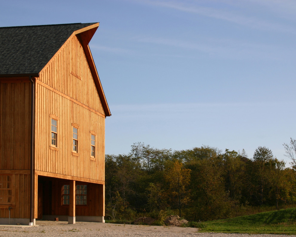 Inspiration for a country exterior in Columbus with wood siding.